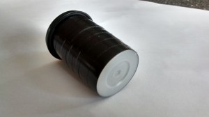 Using a clear canister wrapped in black tape, the base acts as a screen. Sunlight passes through the pinhole which then appears as a small, bright spot on the base of the canister - moving this to the centre of the base by adjusting the orientation of the scope ensures the scope is directly aligned with the Sun for viewing. 