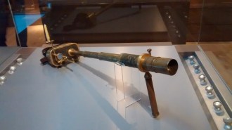 A telescope that is worn (note straps behind) and has a candle to assist with seeing where you are moving! 