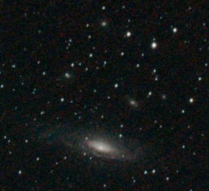 NGC 7331 spiral galaxy (foreground) and Deer Lick Group above (see main anotated picture for detailed location). Light form the Deer Lick Group of galaxies is 400 million years old.